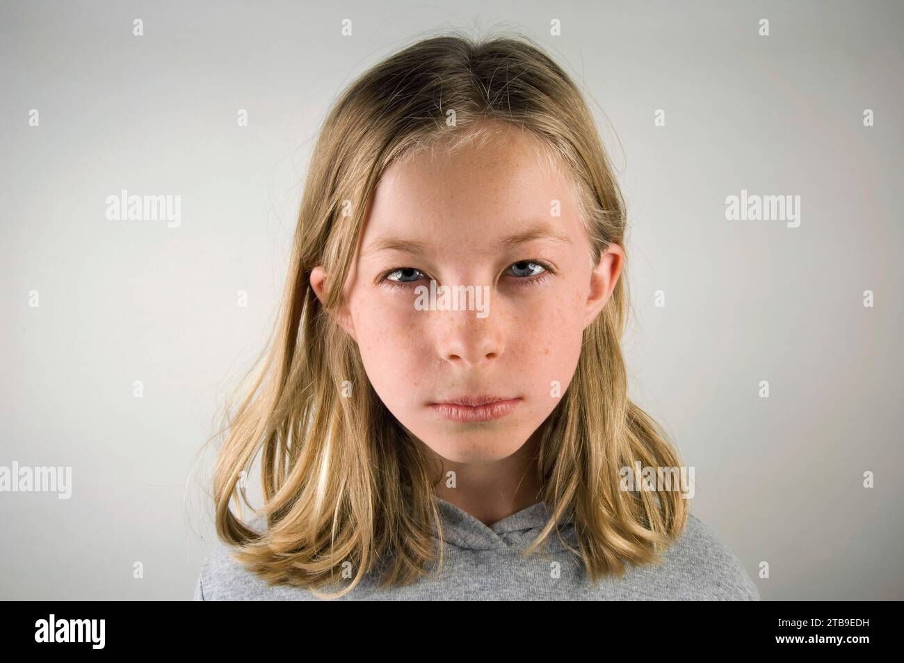 Preteen girl with a scowl on her face; Lincoln, Nebraska, United States of America. Stock Photo