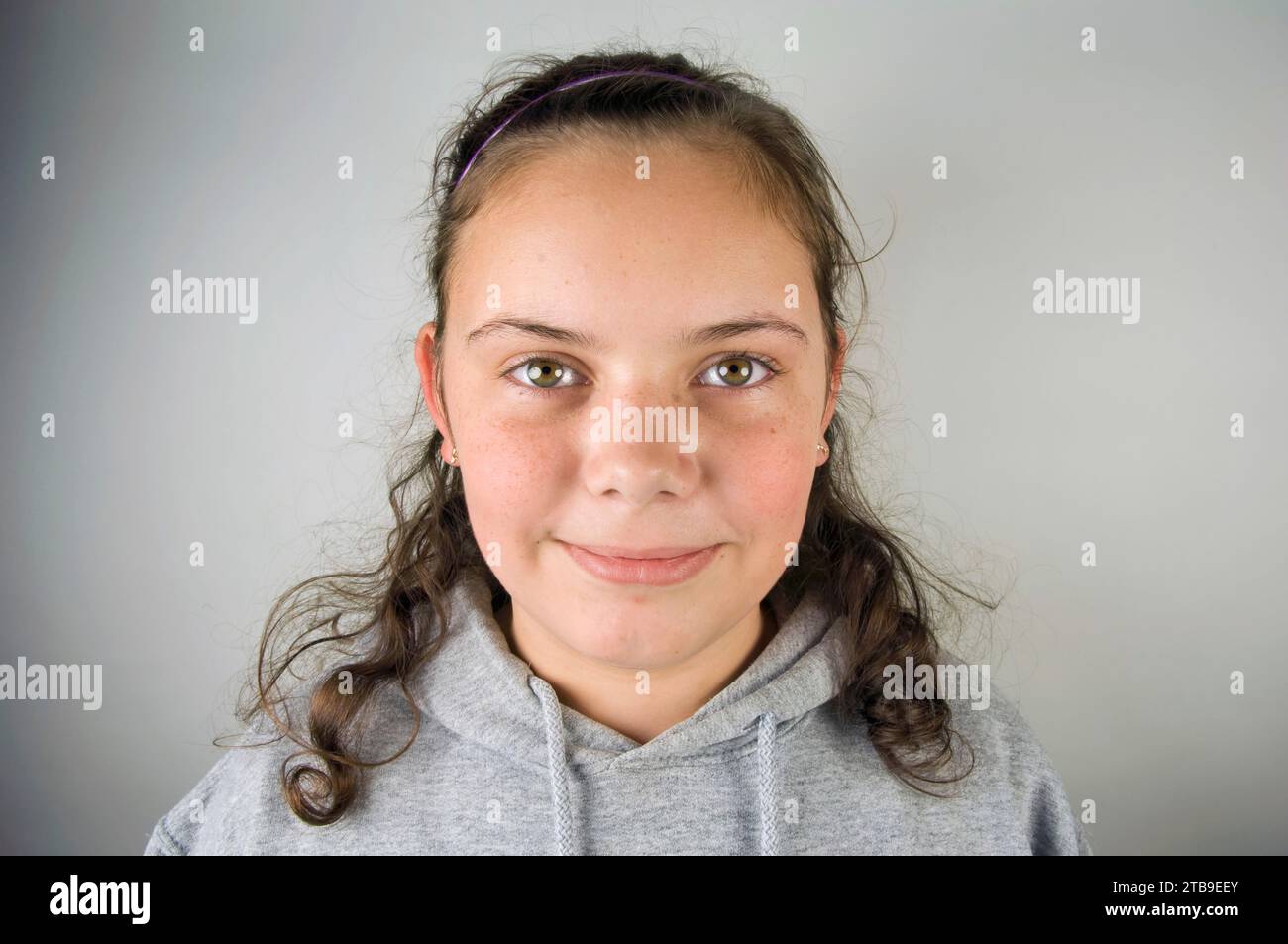Portrait of a beautiful pre-adolescent girl; Studio Stock Photo