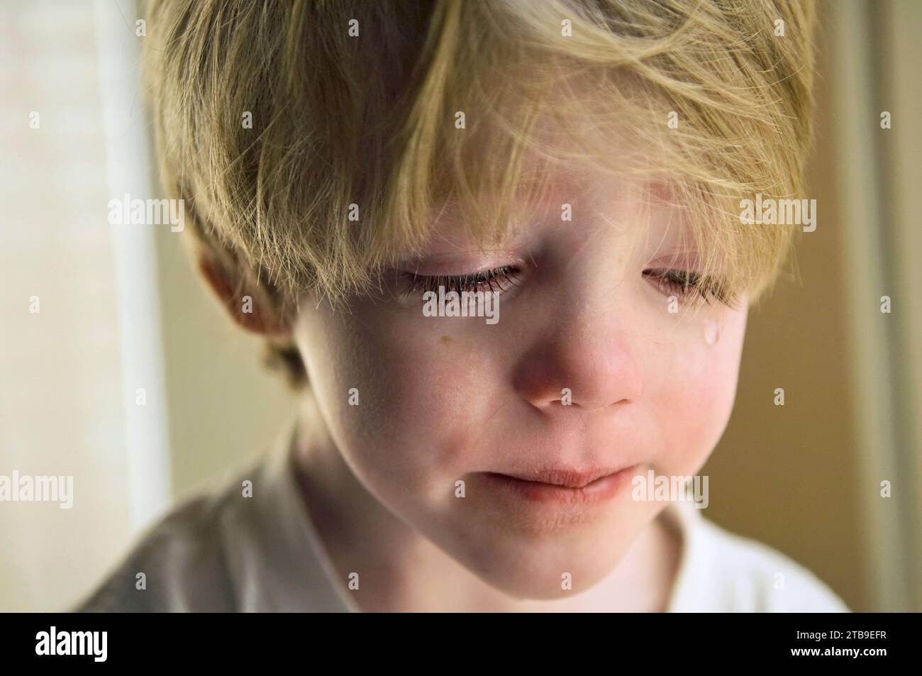 Portrait of a 4-year-old boy crying at his home; Lincoln, Nebraska, United States of America Stock Photo