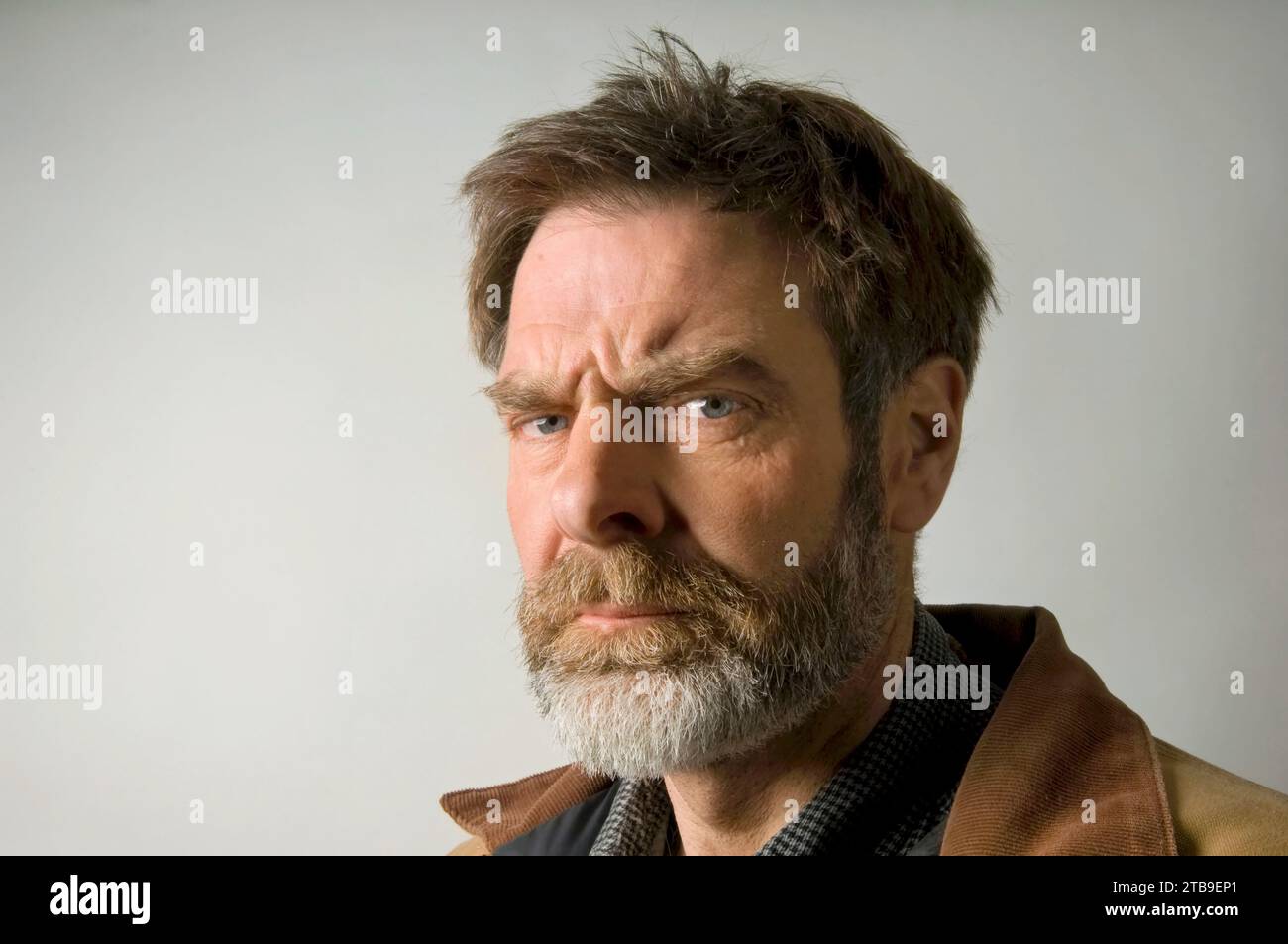 Studio portrait of a mature man with a wrinkled brow; Studio Stock Photo