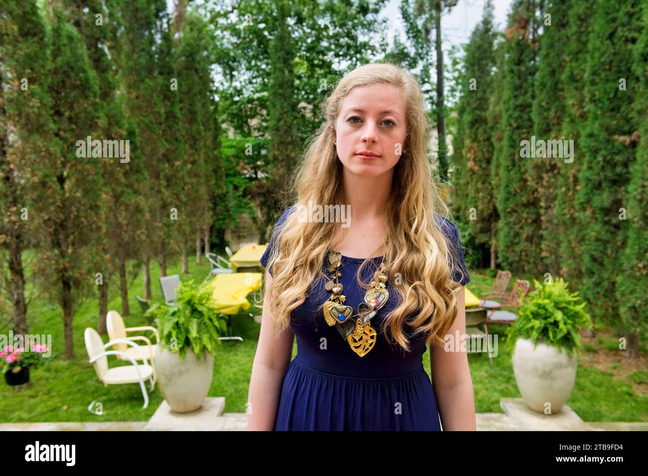 Teenage girl poses for a portrait at her high school graduation party; Lincoln, Nebraska, United States of America Stock Photo