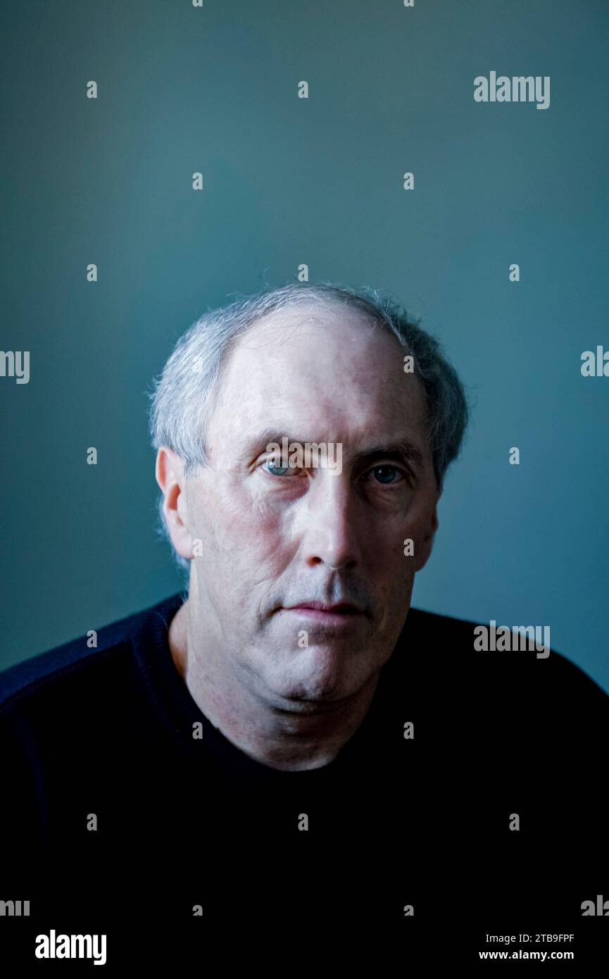 Portrait of a mature man against a blue background; Studio Stock Photo