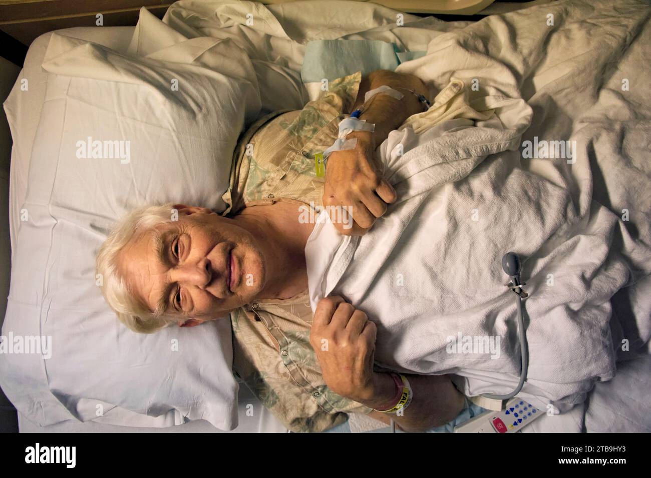 Elderly man in a hospital bed after surgery; Lincoln, Nebraska, United States of America Stock Photo