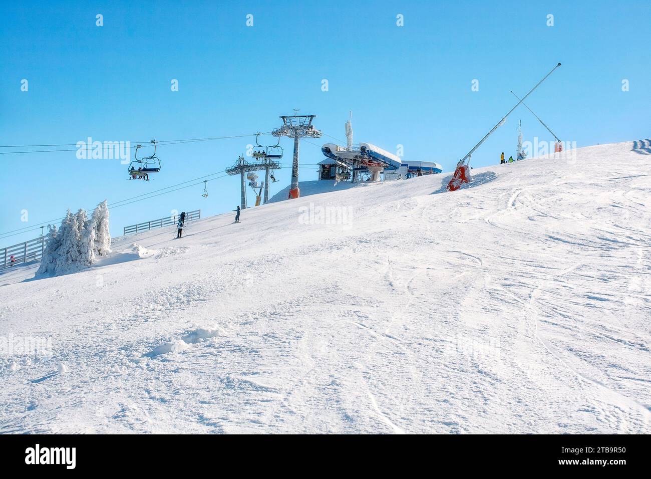 Kopaonik, Serbia - January 22, 2016: Ski resort Kopaonik, Serbia, ski lift, ski slope, people skiing down from the lift Stock Photo
