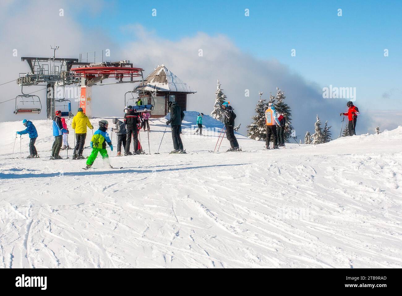 Kopaonik, Serbia - January 22, 2016: Ski resort Kopaonik, Serbia, ski lift, ski slope, people skiing down from the lift Stock Photo
