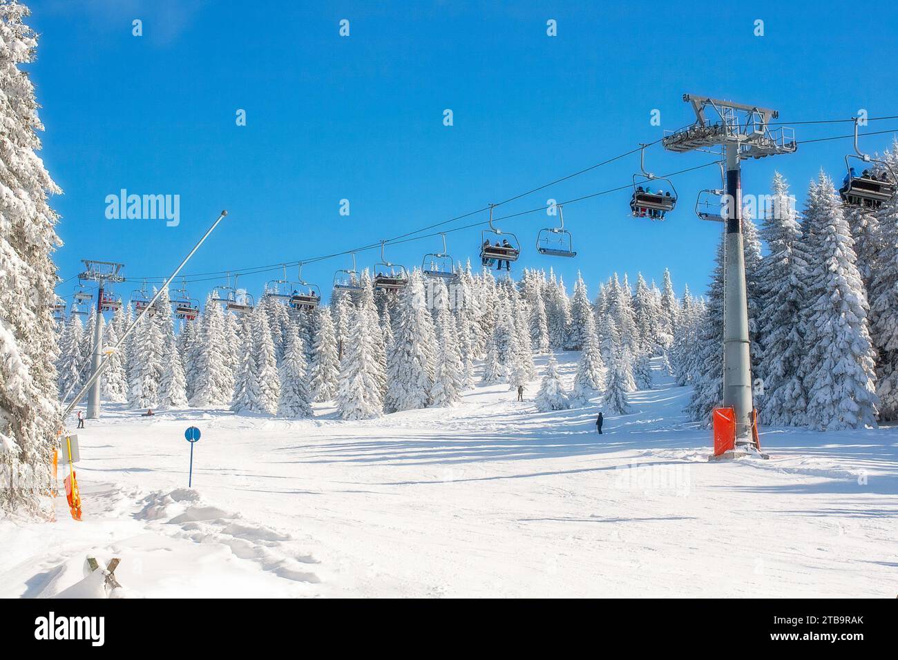 Panorama of ski resort Kopaonik, Serbia, slope, chair lift and trees covered with snow Stock Photo