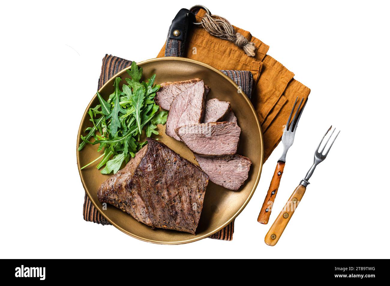 Roast Tri Tip or sirloin bottom beef steak on a plate with arugula