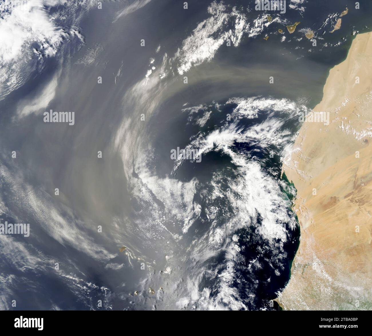 July 26, 2022 - Satellite view of a fresh plume of dust as it streamed over Western Sahara. Stock Photo