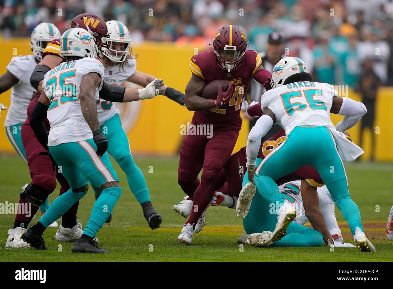 Washington Commanders running back Antonio Gibson (24) looks to dodge a