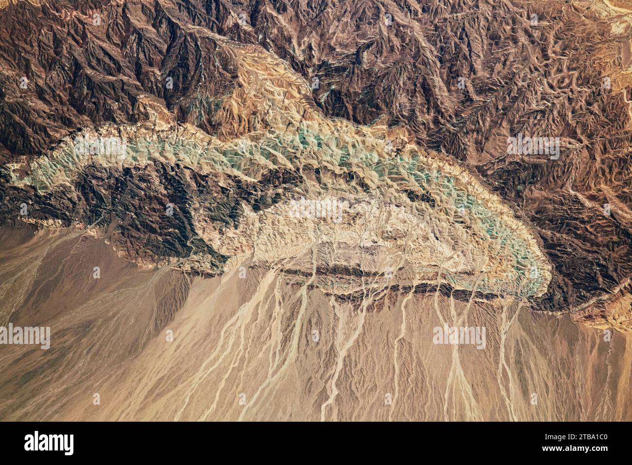 View from space showing a small semicircular mountain in the Dasht-e Kavir Desert, Iran. Stock Photo