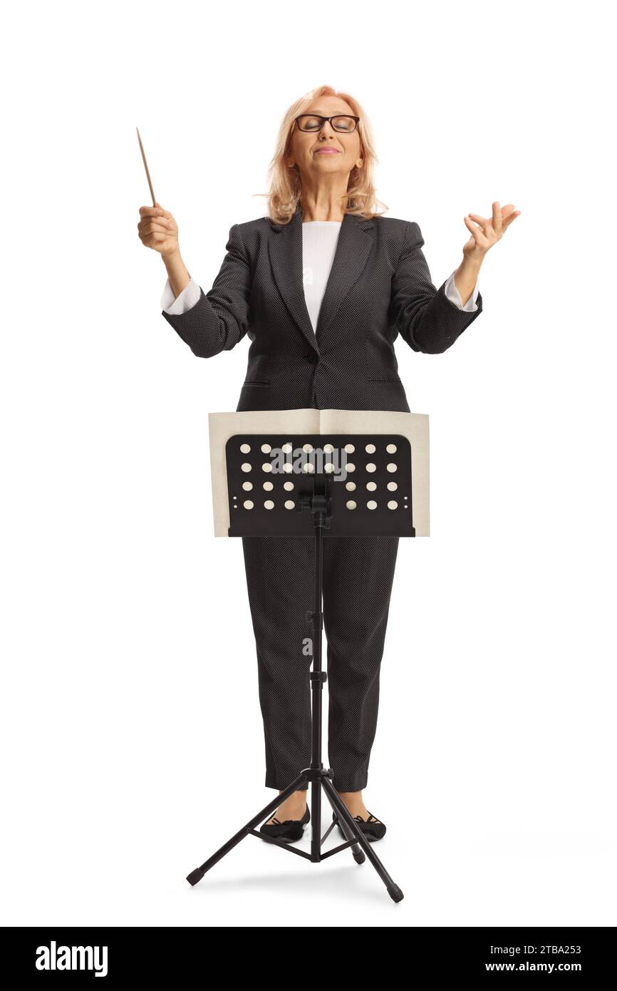 Full length portrait of a female conductor directing an orchestra isolated on white background Stock Photo