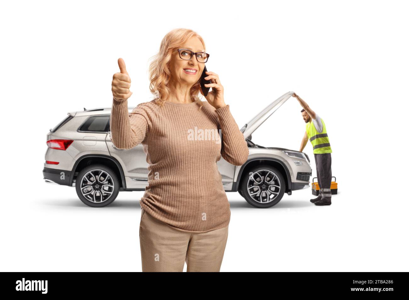 Woman with a car problem calling a mechanic and gesturing thumbs up