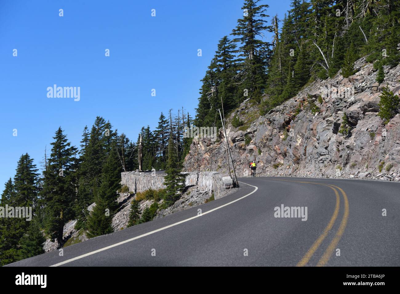 Bikers struggle the uphill climb on Rim Drive in Crater Lake National