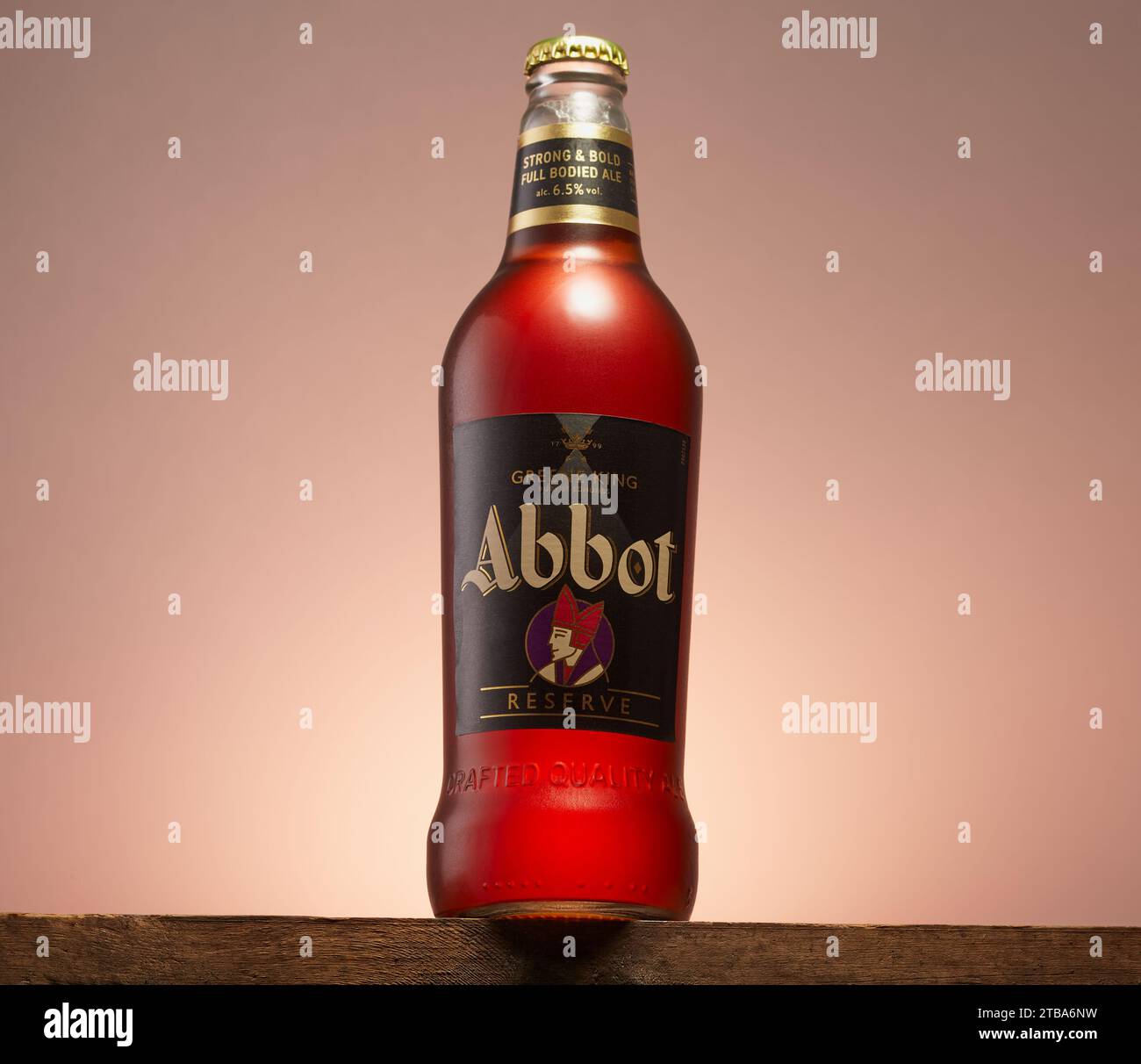 Mansfield,Nottingham,United Kingdom,30th November 2023:Studio product image of a bottle of Abbot Ale on a nice gradient background. Stock Photo