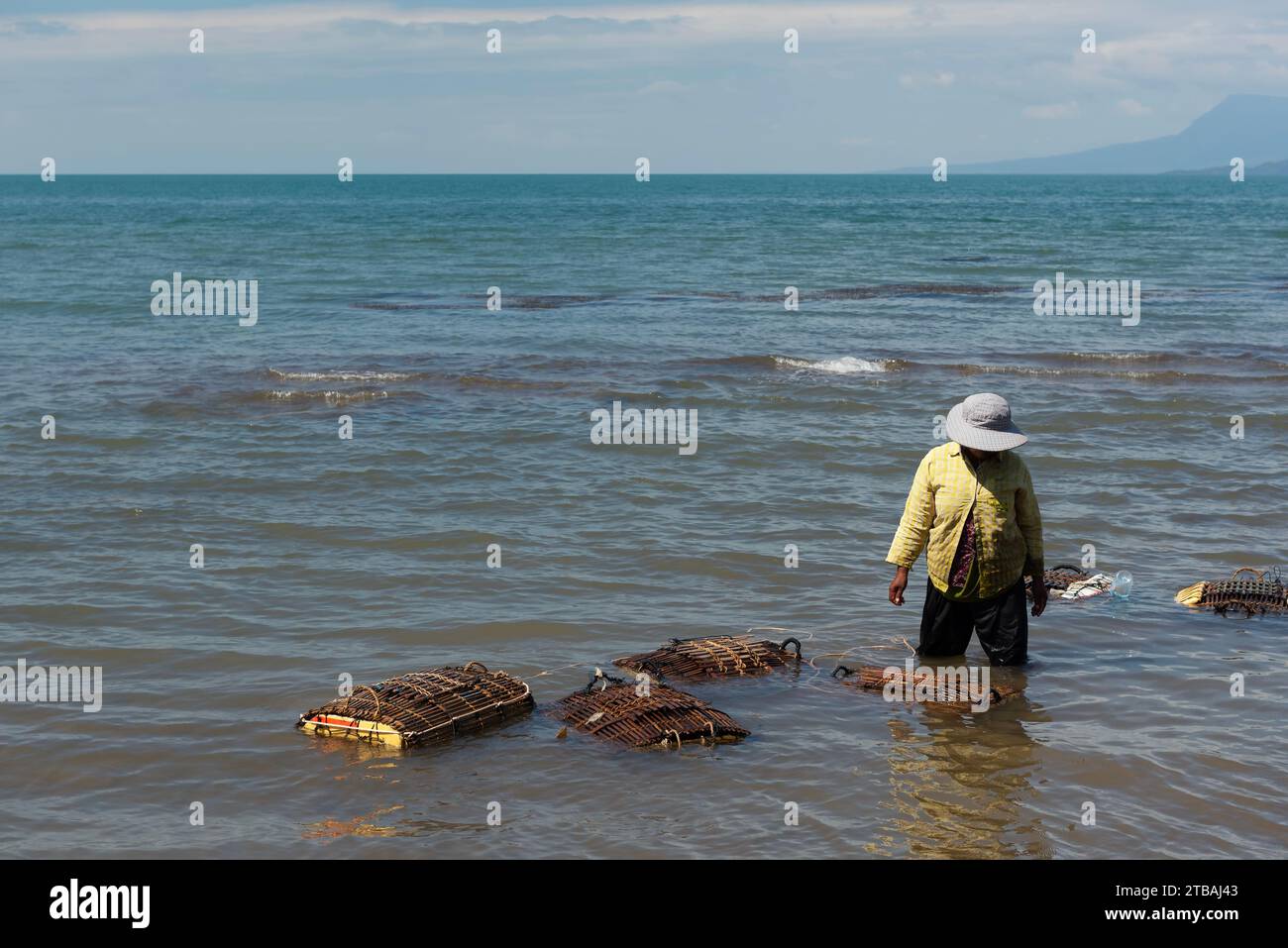 Fisherwoman checking crab pots in Kep - Cambodia Stock Photo