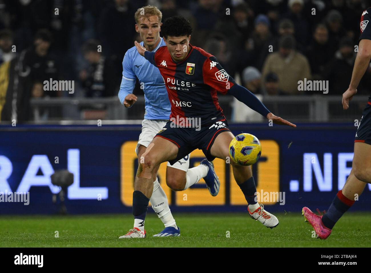 Rome, Italy. 05th Dec, 2023. Alan Matturro of Genoa C.F.C. and Gustav Isaksen of S.S. Lazio during the round of 16 of the Frecciarossa Italian Cup between S.S. Lazio - Genoa C.F.C., 5 December 2023 at the Olympic Stadium in Rome. Credit: Independent Photo Agency/Alamy Live News Stock Photo