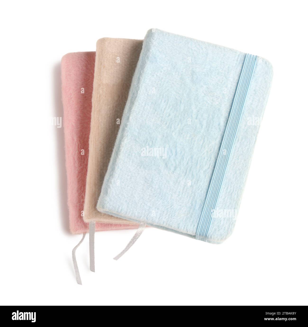 Stack of different notebooks isolated on white background Stock Photo