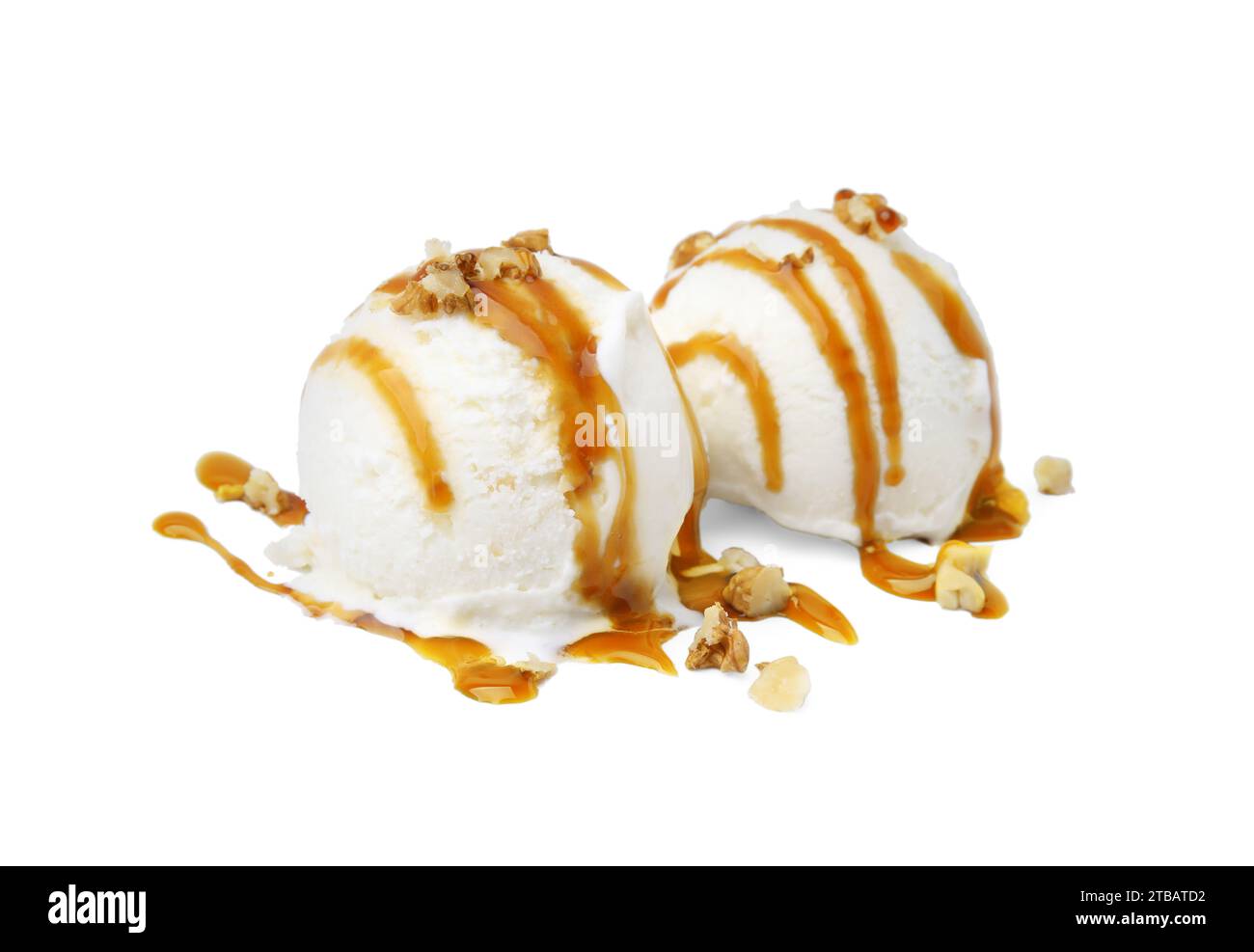 Scoops of ice cream with caramel sauce and nuts isolated on white Stock ...