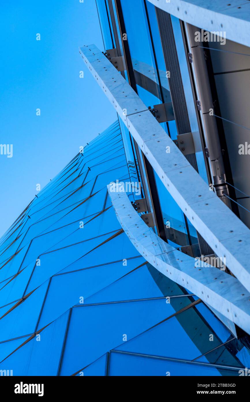 Looking up at the curved glass exterior of the Crown Sydney hotel and Casino at North Barangaroo in Sydney, Australia Stock Photo