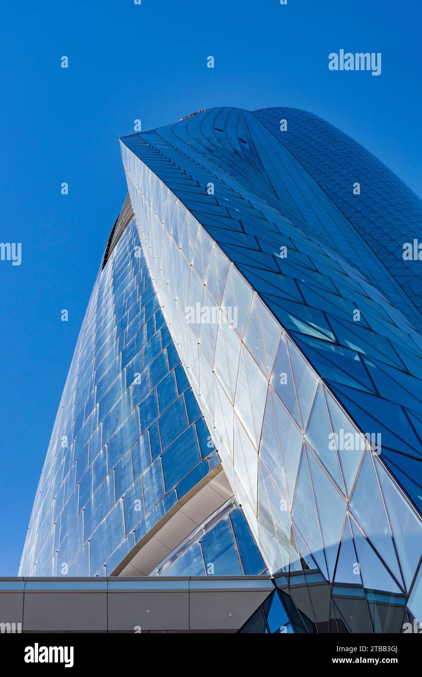 Looking up at the curved glass exterior of the Crown Sydney hotel and Casino at North Barangaroo in Sydney, Australia Stock Photo