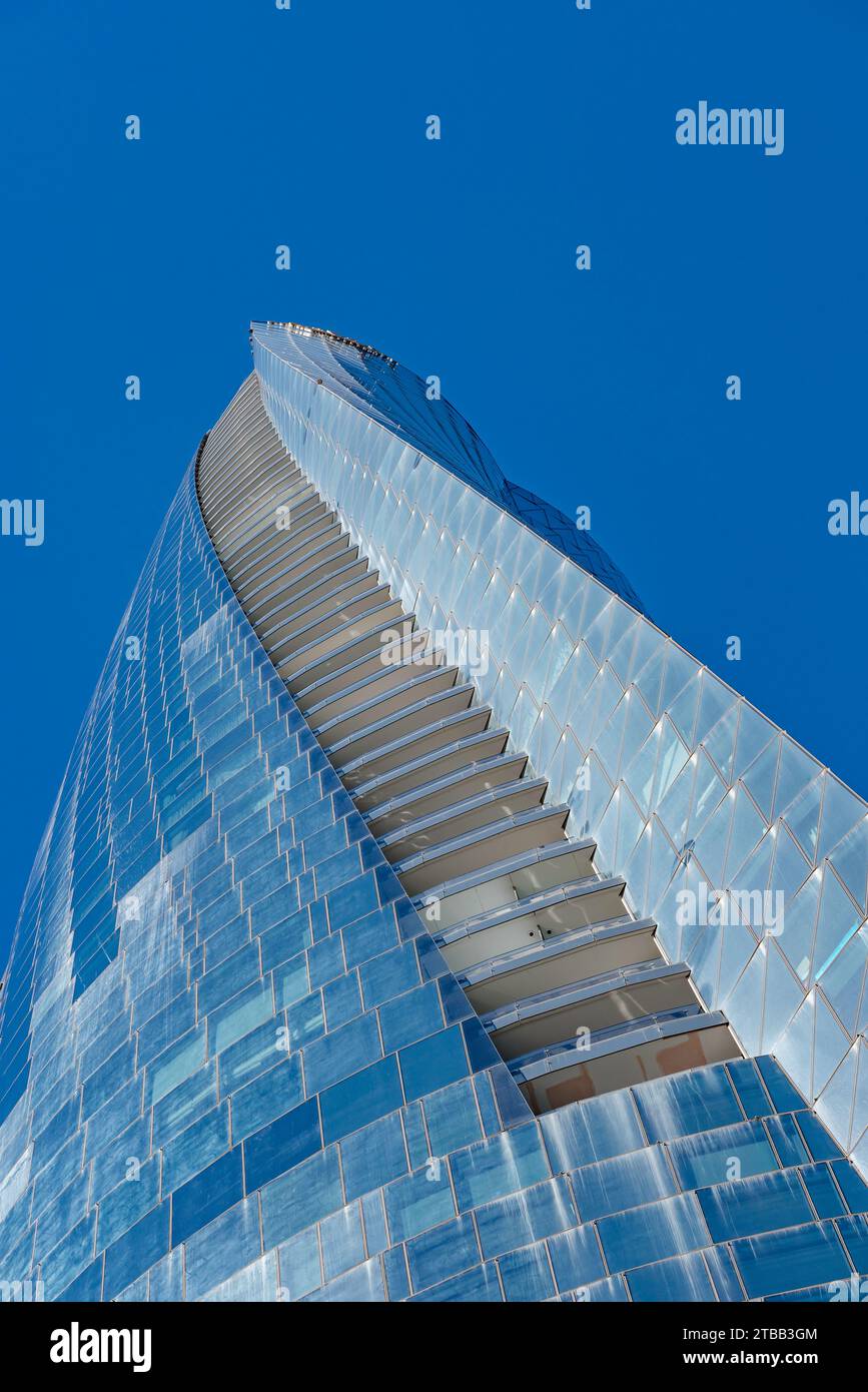 Looking up at the curved glass exterior of the Crown Sydney hotel and Casino at North Barangaroo in Sydney, Australia Stock Photo