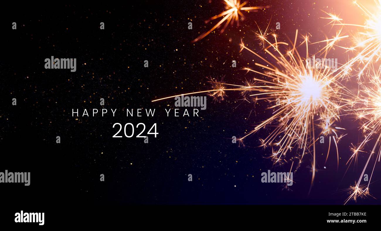 Happy new year 2024, New Year's Eve Party background greeting card - sparkling from fireworks for New Year's celebrations, banner design. Stock Photo