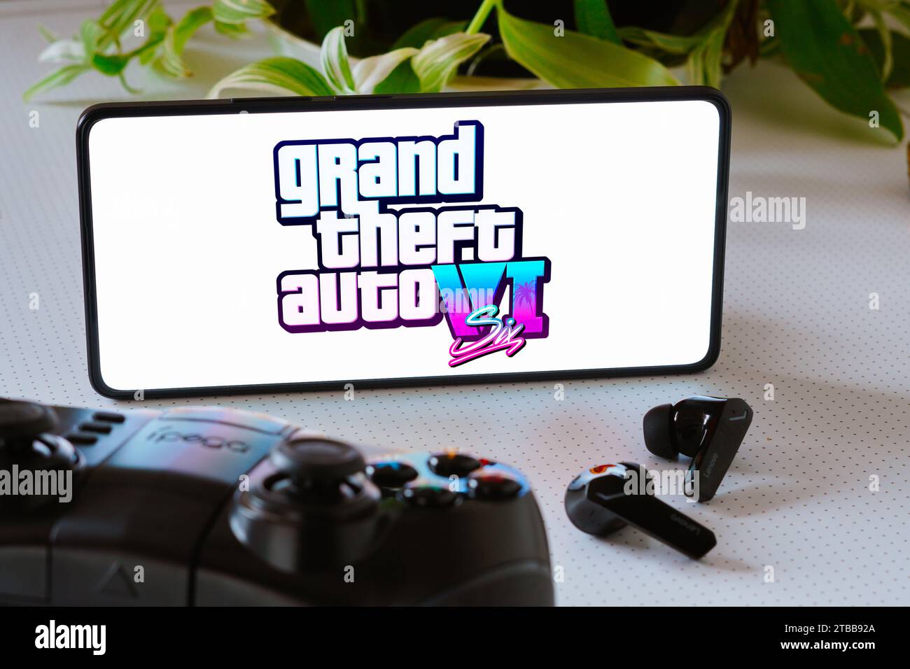 Brazil. 25th Oct, 2023. In this photo illustration, the Grand Theft Auto VI (GTA 6) game logo is displayed on a smartphone screen, next to a gamepad and headphones. (Credit Image: © Rafael Henrique/SOPA Images via ZUMA Press Wire) EDITORIAL USAGE ONLY! Not for Commercial USAGE! Stock Photo