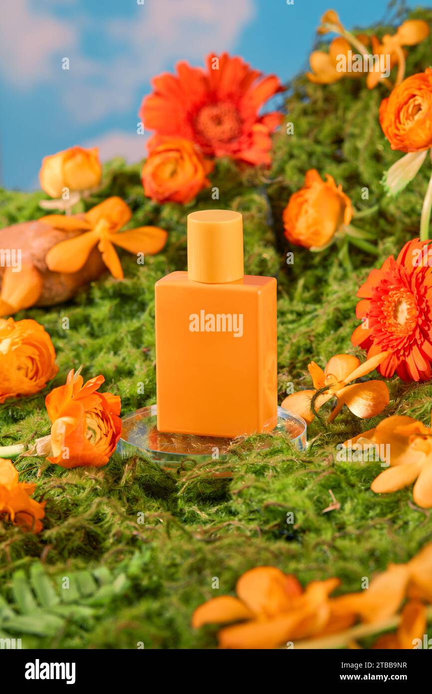 Closeup of an orange perfume bottle standing out against a background