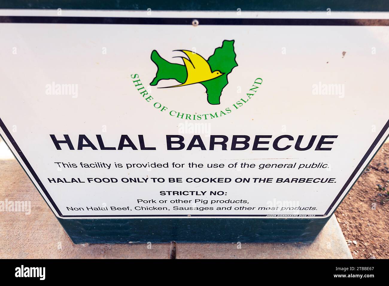 Sign for Halal barbecue on the foreshore of the small town of Settlement, Christmas Island, Australia Stock Photo