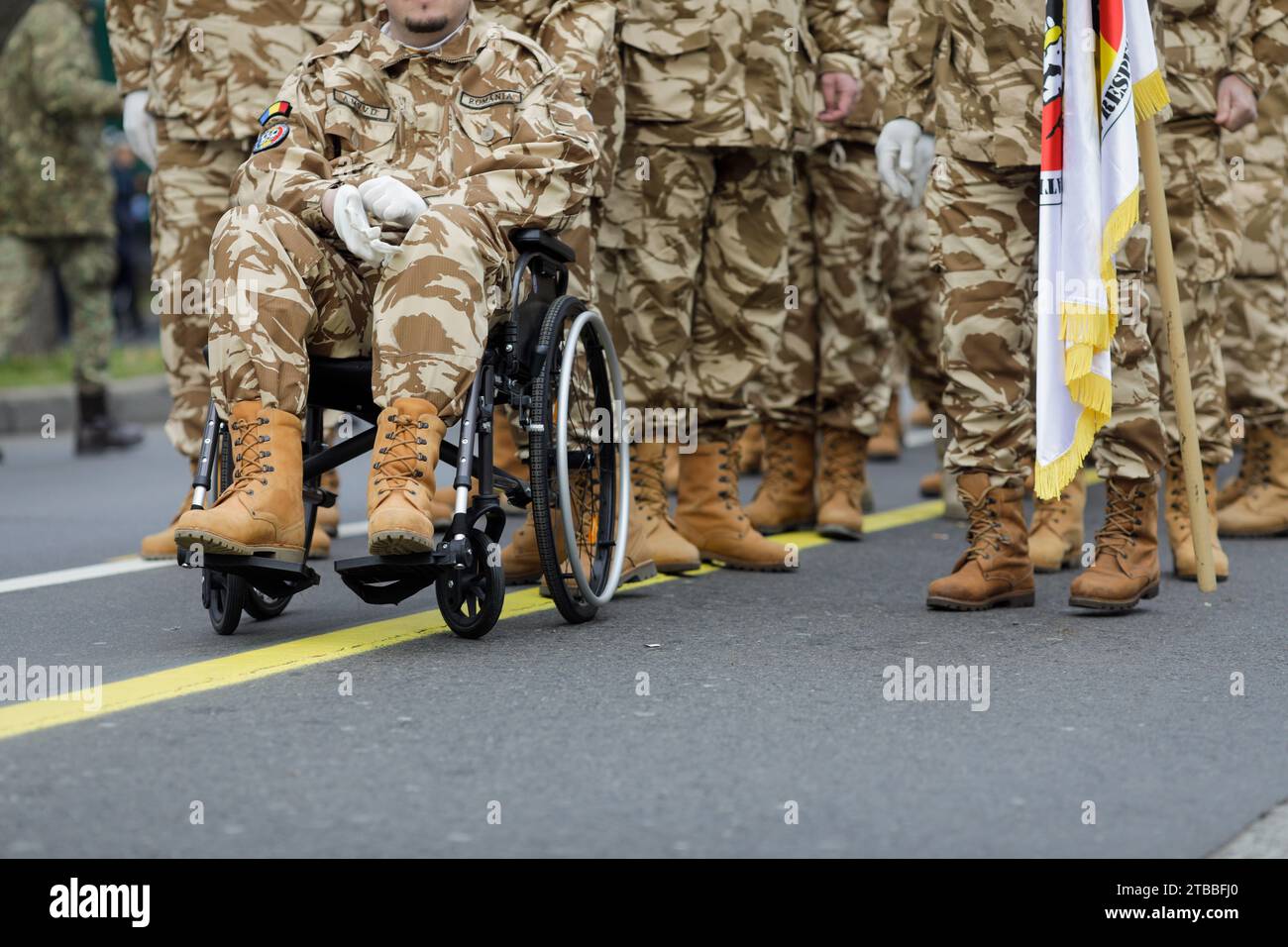 Bucharest, Romania - December 1, 2023: Shallow depth of field (selective focus) image with Romanian army veteran soldiers, of which one is injured and Stock Photo
