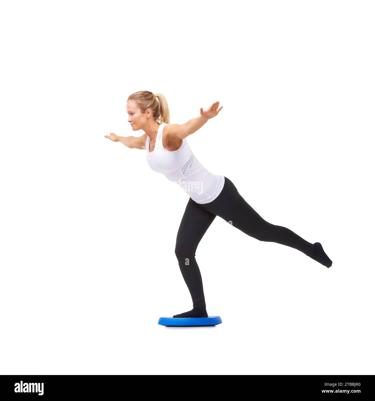 Balance, workout and fitness with woman on disk in studio for health