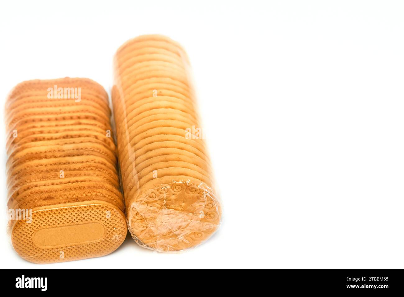 Delicious sweet cookies in a protective cellophane package for sale on a white  Stock Photo