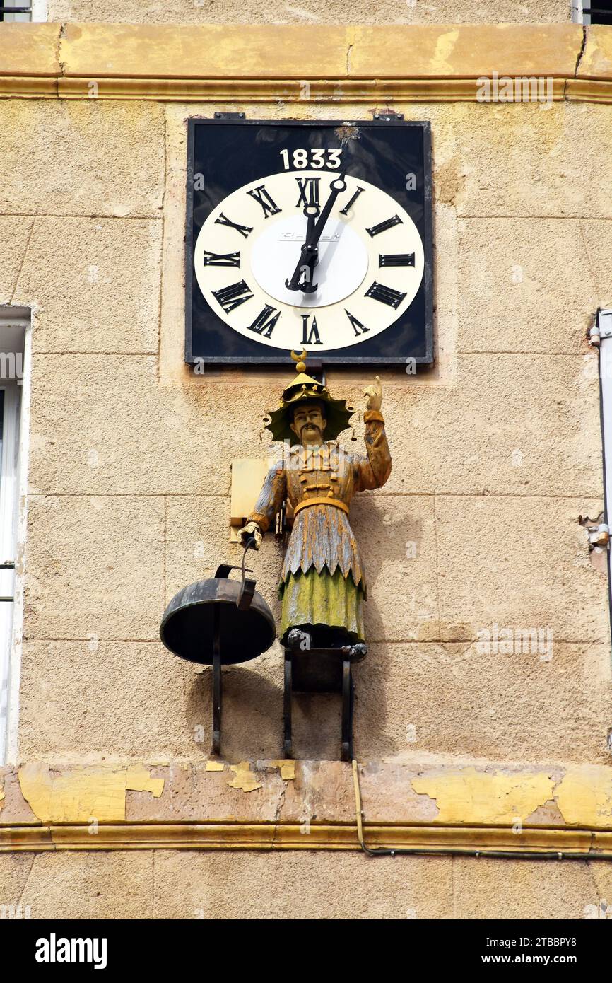 Clock, dated 1833, on the 3rd floor of a house in  Aix-en-Provence, with an automaton, a Jacquemart, of a man in Chinese costume striking a bell Stock Photo