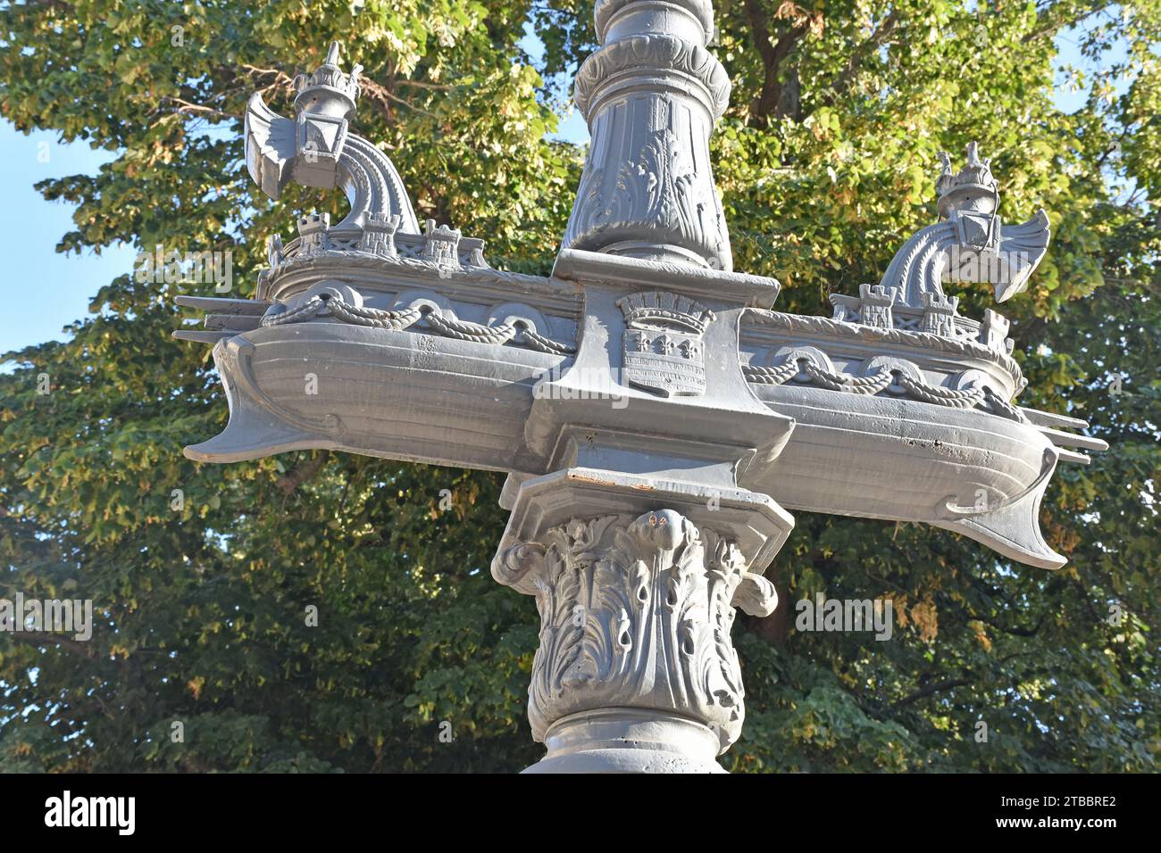 One of a pair of Rostral columns at the entrance to Plateau des Poètes, Beziers France, cast iron column with ship & glass globes of street lighting Stock Photo