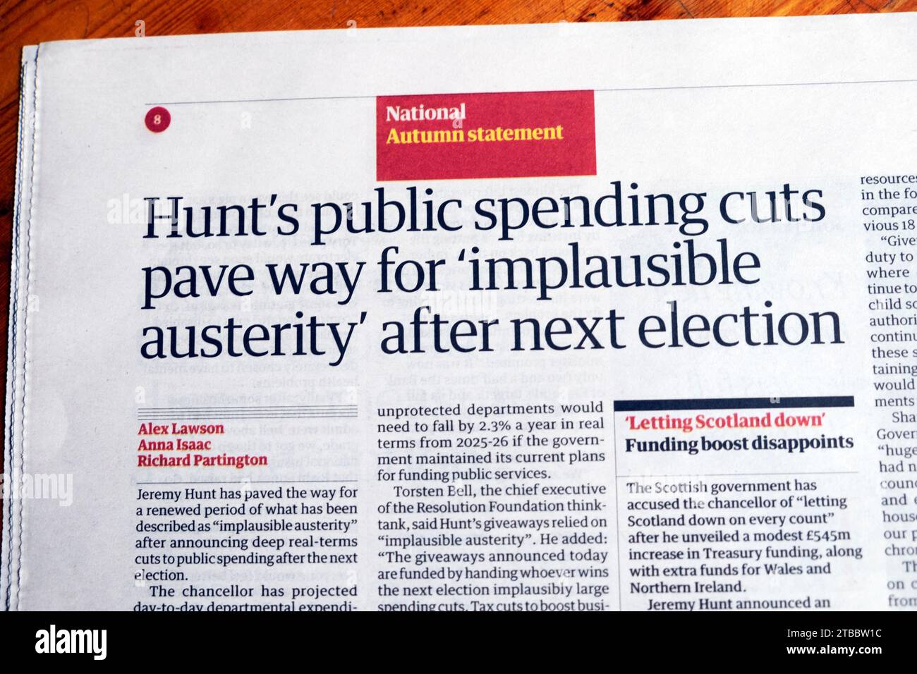 Jeremy 'Hunt 's public spending cuts pave way for 'implausible austerity' after next election' Guardian newspaper headline autumn statement 2023 in UK Stock Photo