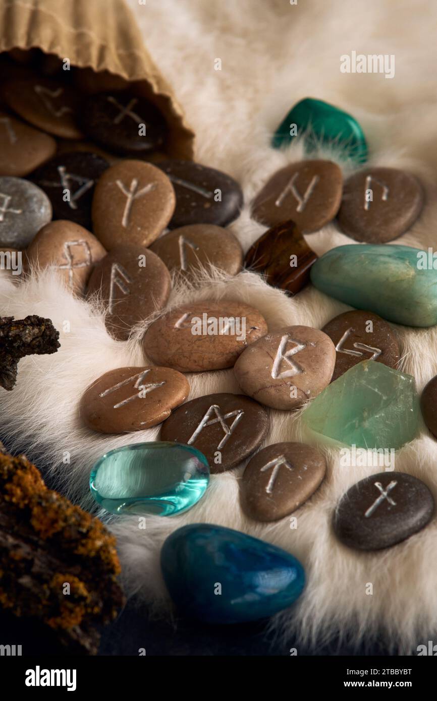 handmade stone runes on white fur Stock Photo - Alamy