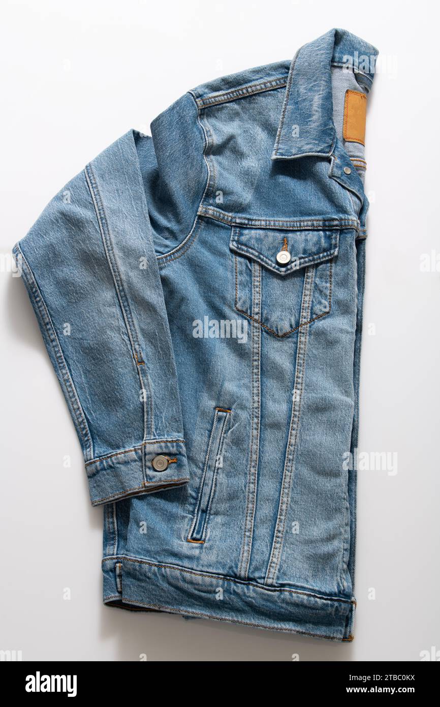 Side View of Blue Truckers Denim Jacket Isolated on White Background Stock Photo