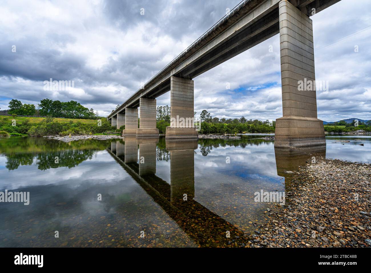 Traffic bridge over still water of Mann River at Jackadgery, NSW
