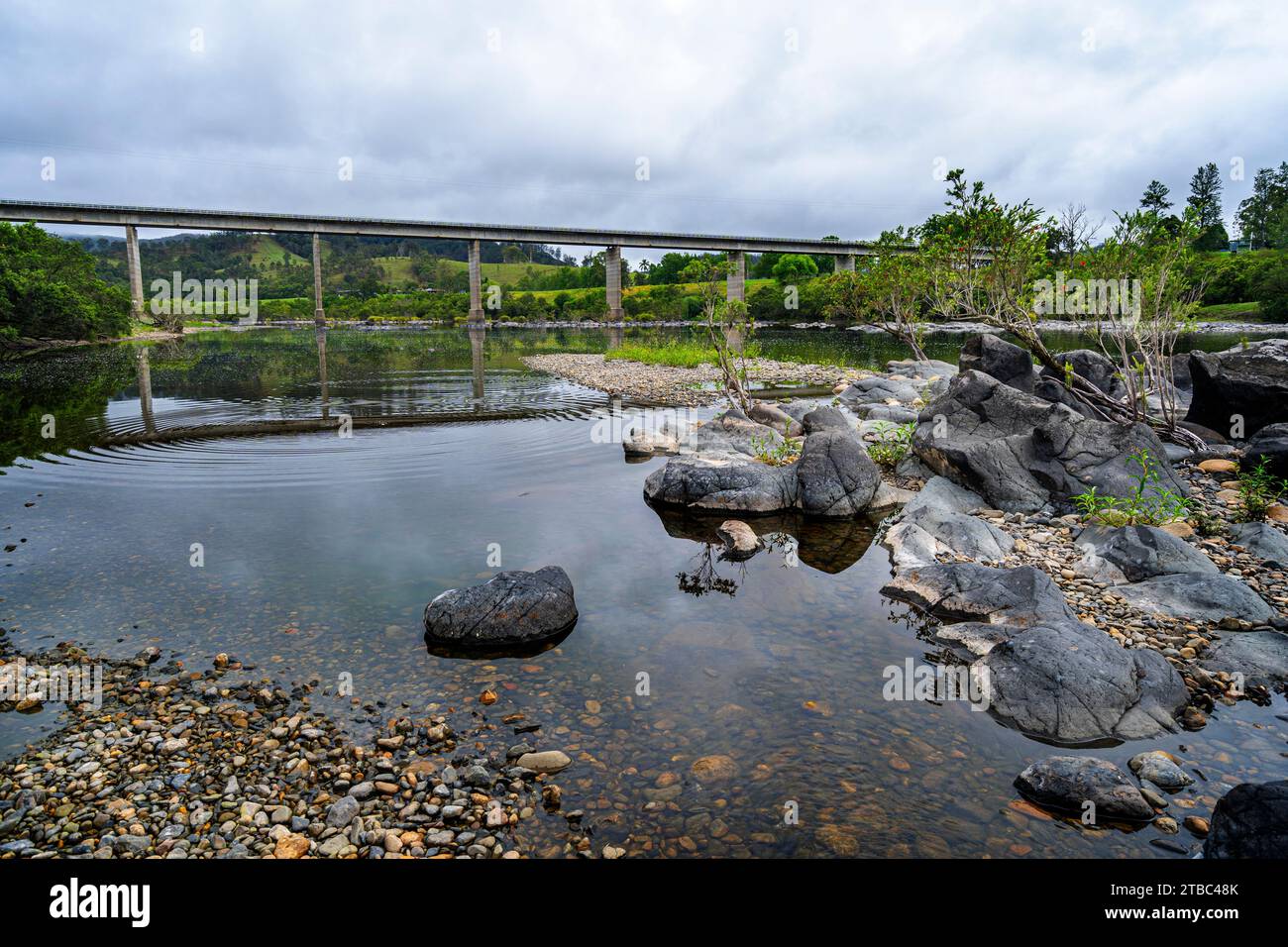 Traffic bridge over still water of Mann River at Jackadgery, NSW