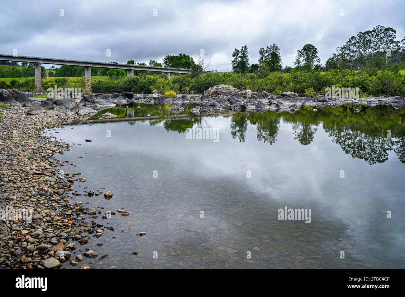 Traffic bridge over still water of Mann River at Jackadgery, NSW