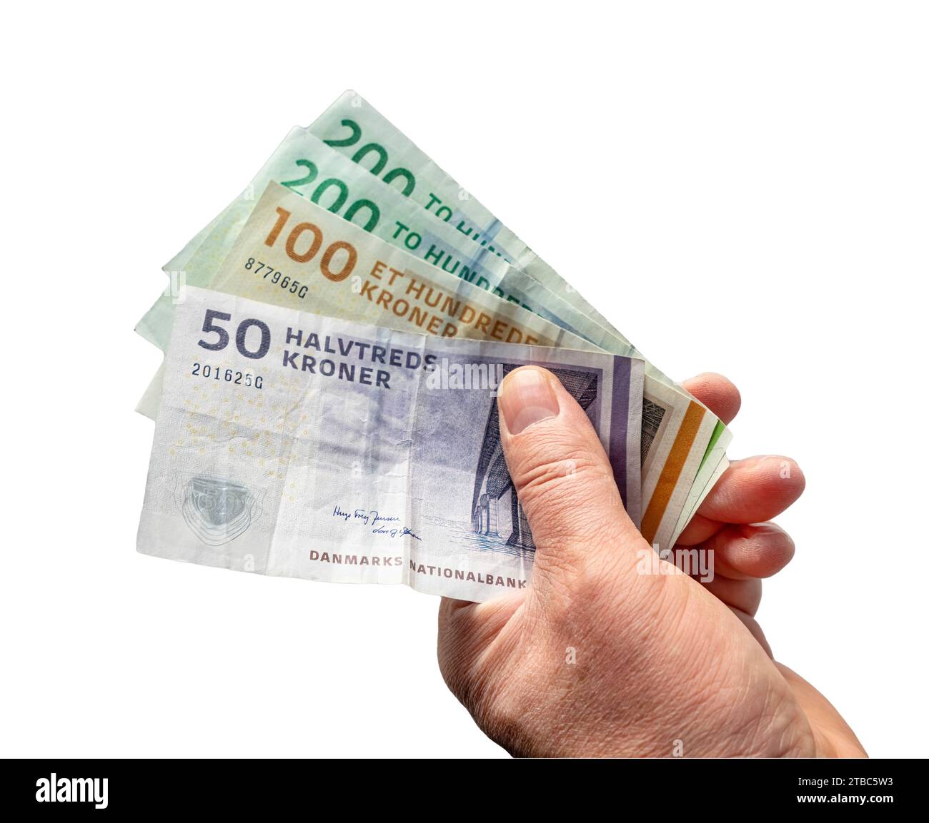 some Danish krone banknotes in a male hand with a transparent background Stock Photo