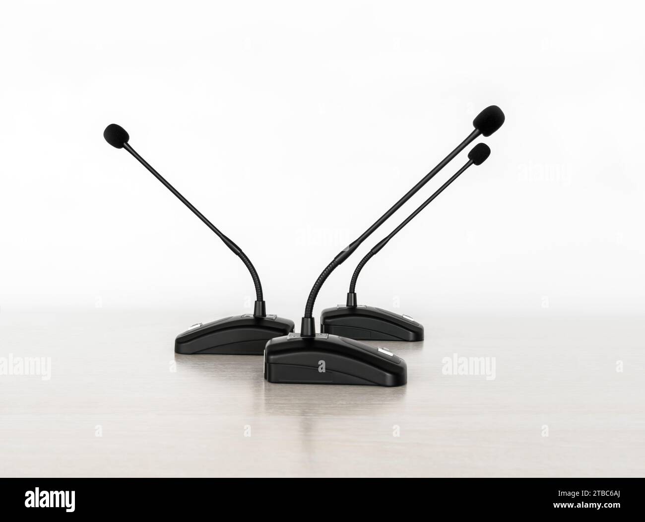 Three cardioid gooseneck microphones for conferences and desktop systems on a white background Stock Photo