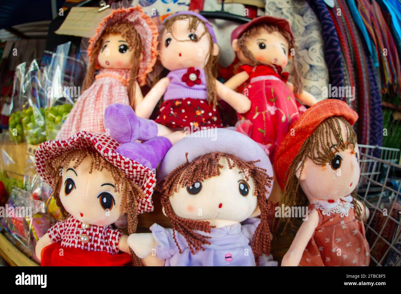 Shop in Thailand of dolls dressed in brightly colored costumes specific to the northern area Stock Photo