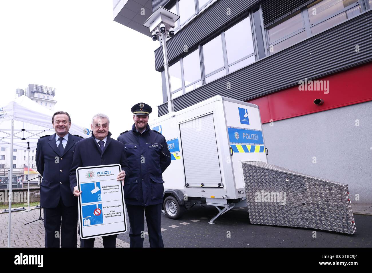 Duisburg, Germany. 06th Dec, 2023. Thomas Roosen, Director of the State Office for Central Police Services, Herbert Reul (CDU), and Christoph Meurers stand in front of the police's new mobile video surveillance system. Credit: David Young/dpa/Alamy Live News Stock Photo