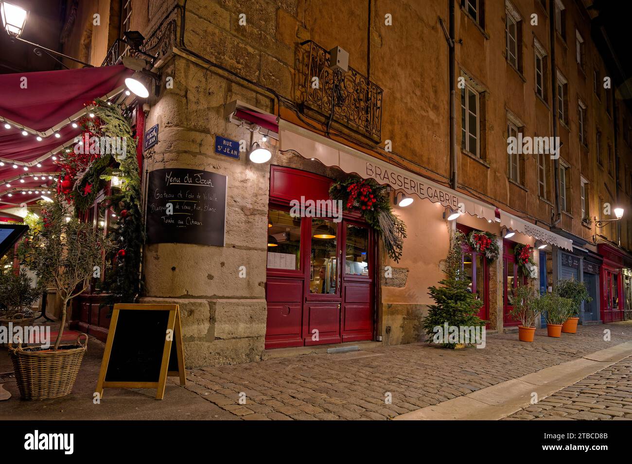 LYON, December 5, 2023 : Streets of Vieux-Lyon district by night. Lyon commemorates 25 years of inscription of old city center on World Heritage sites Stock Photo