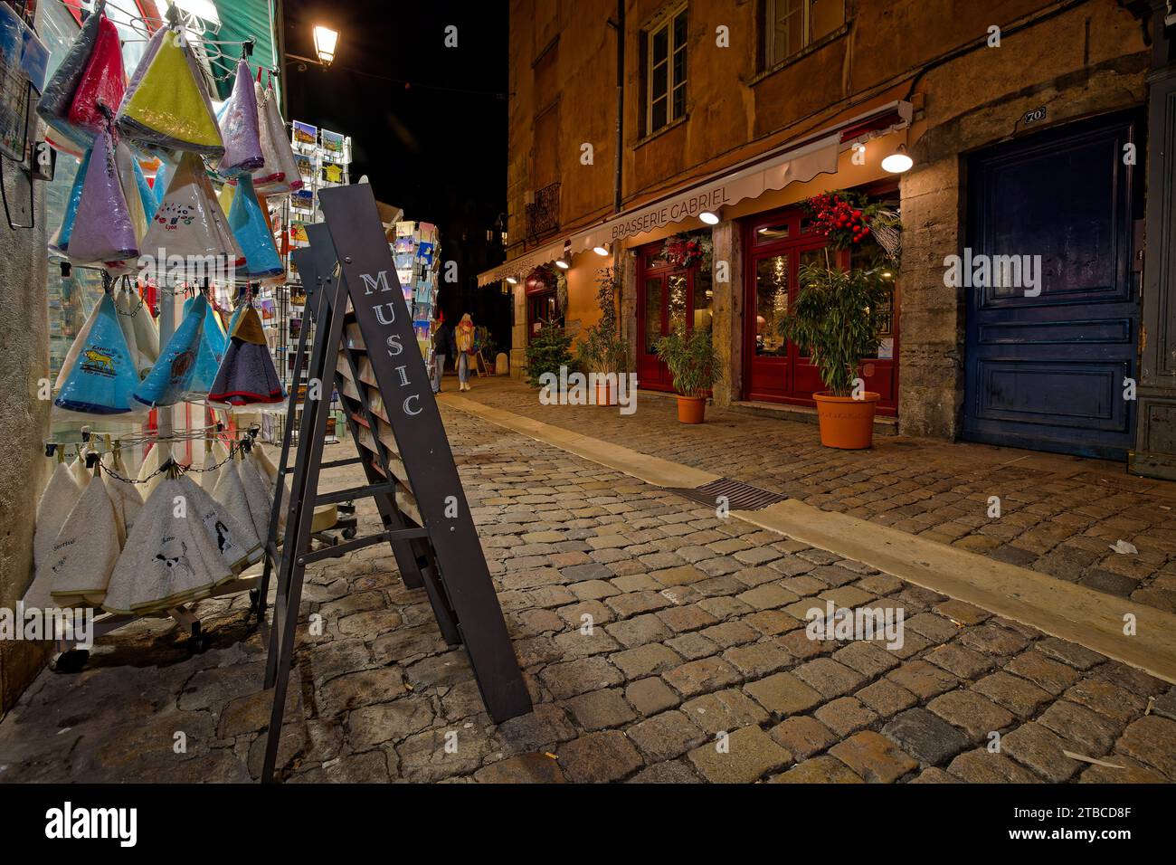 LYON, December 5, 2023 : Streets of Vieux-Lyon district by night. Lyon commemorates 25 years of inscription of old city center on World Heritage sites Stock Photo
