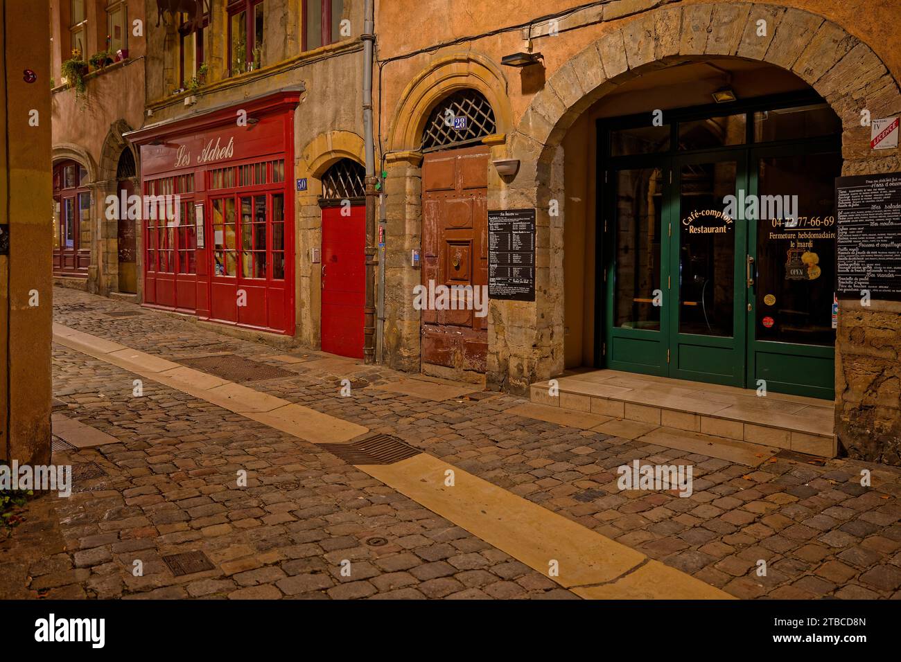 LYON, December 5, 2023 : Streets of Vieux-Lyon district by night. Lyon commemorates 25 years of inscription of old city center on World Heritage sites Stock Photo