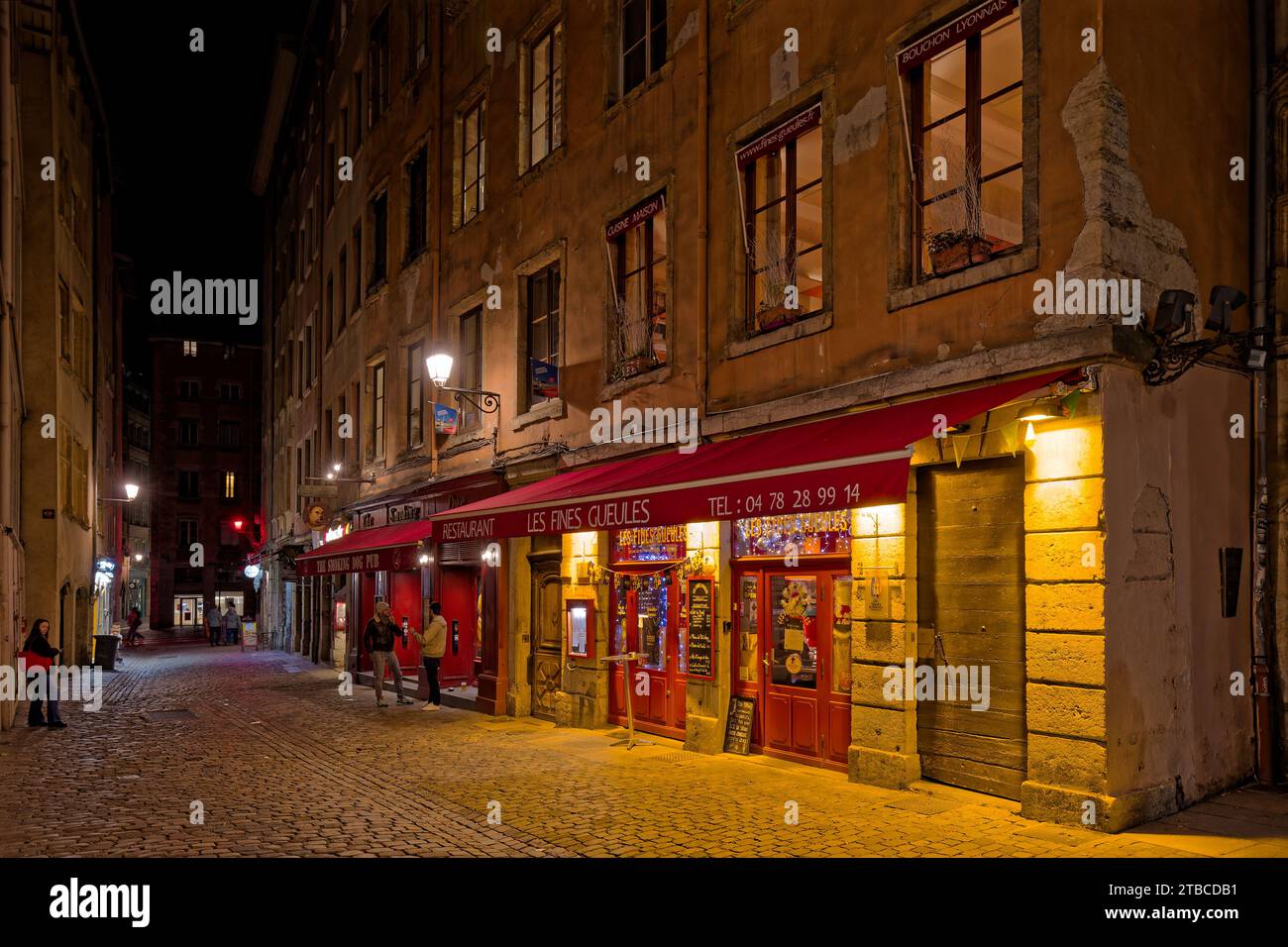 LYON, December 5, 2023 : Streets of Vieux-Lyon district by night. Lyon commemorates 25 years of inscription of old city center on World Heritage sites Stock Photo
