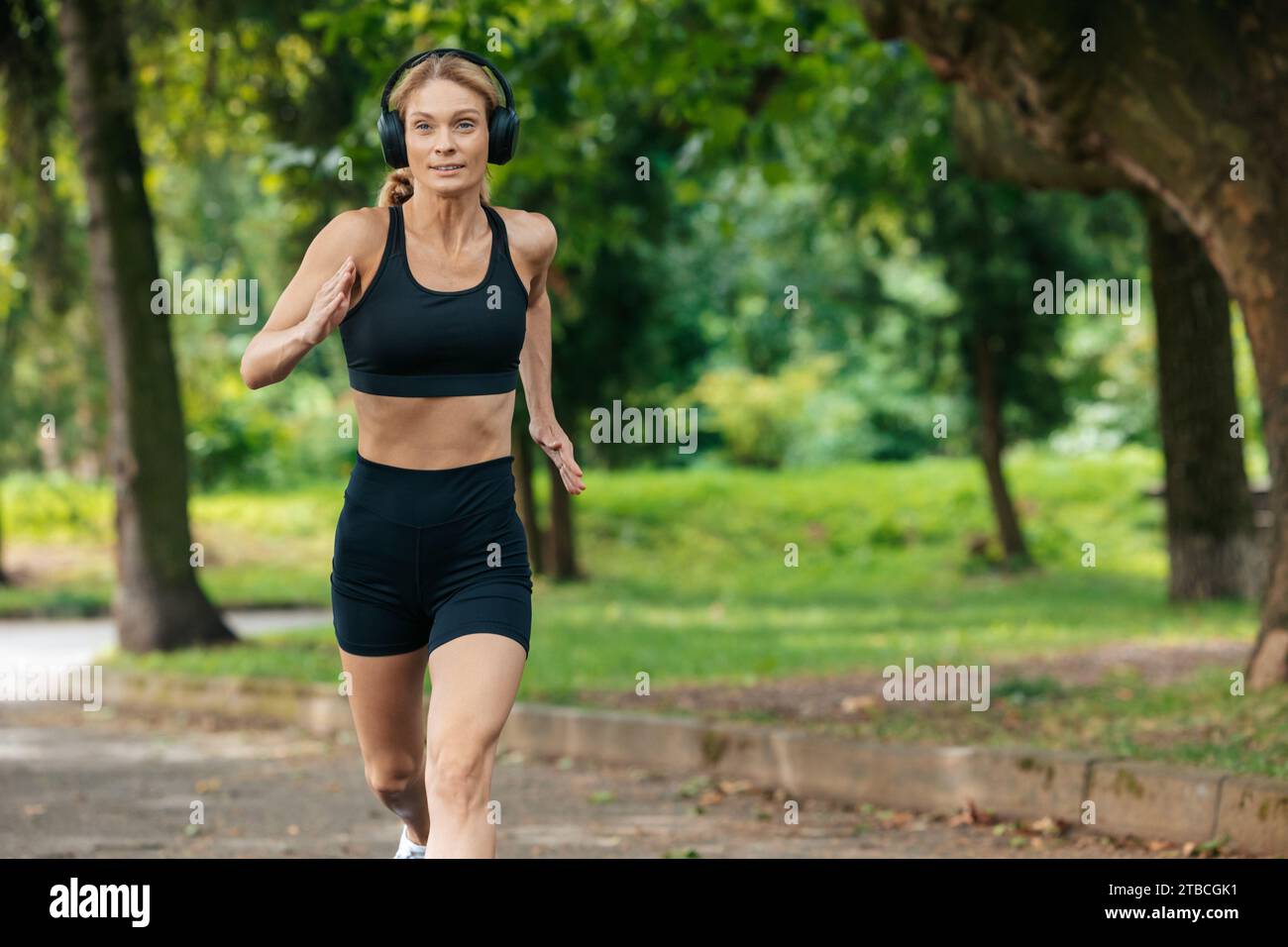 Beautiful woman running cross hi-res stock photography and images - Alamy