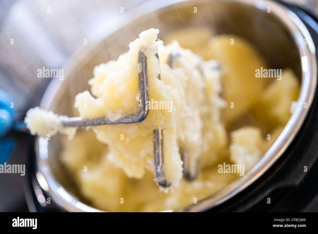 Whipping Up Creamy Mashed Potatoes in Modern Kitchen Stock Photo Alamy